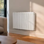 Un radiateur electrique blanc fixe au mur d'un salon